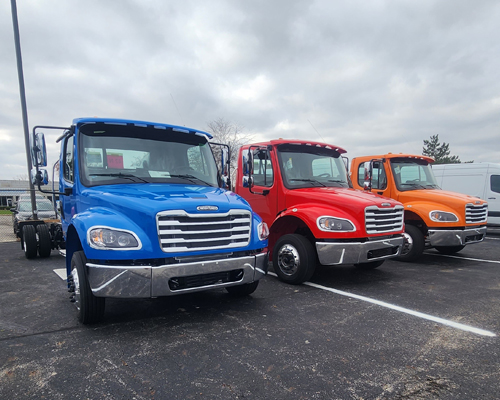 Three new colorful bookmobile chassis in blue, red and orange